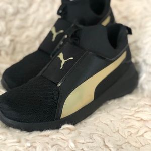 Super cute and comfy black and gold puma sneakers